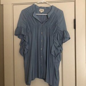 Super cute light blue shirt. Blousy and comfortable
